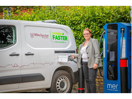 Councillor Learney using one of the new rapid EV chargers.