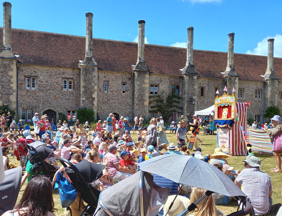 article thumb - Enjoying Punch & Judy in the grounds of the Hospital of St Cross